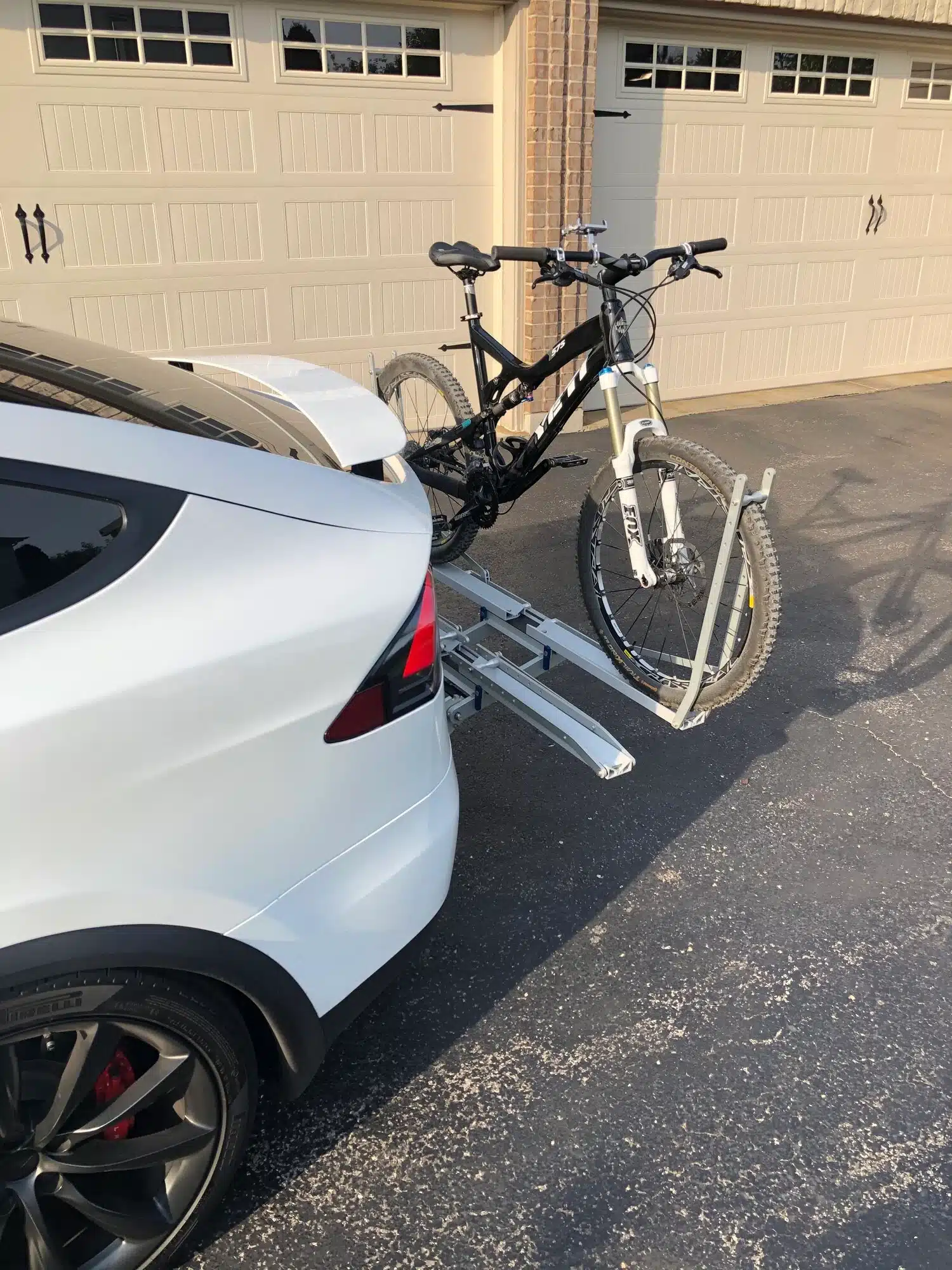 Tesla Model X Vehicle with a hitch mounted bike rack installed